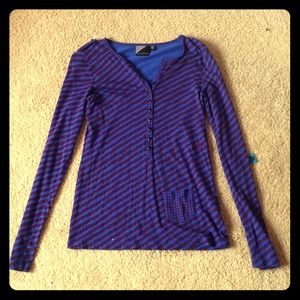 Striped long sleeved top with pocket at bottom