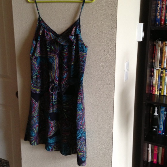 An adorable dress with tie in middle.