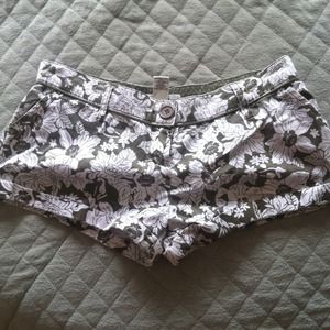 Army green floral print shorts.