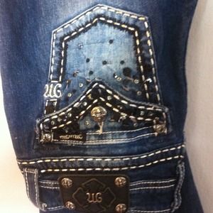 Sexy MISS ME Jeans 29/31 slight flare.