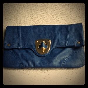 From South Moon under navy blue clutch