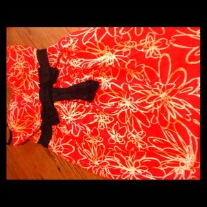 Orange and white dress w/ decorative black bow