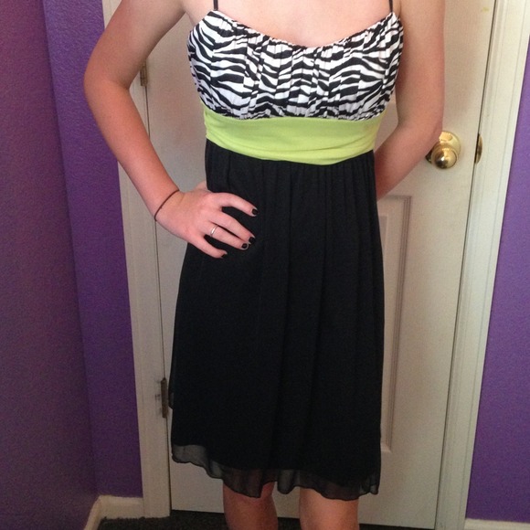 black and zebra print dress with green ribbon