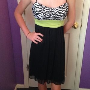 black and zebra print dress with green ribbon