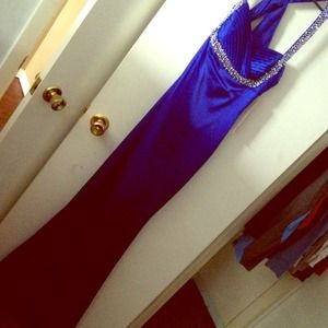 Long blue beaded prom dress.
