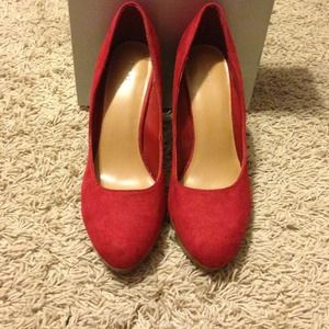 Red suede pumps