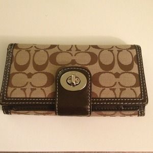 Coach wallet with checkbook insert.