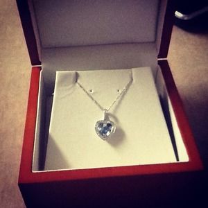 14kt white gold blue topaz and diamon pendant:)