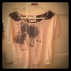A pale pink, edgy top with black lace on back 💋