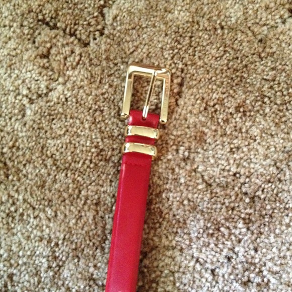 Red belt with gold buckle
