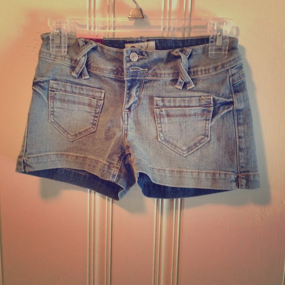 Light colored blue jean shorts, twisted belt loop.