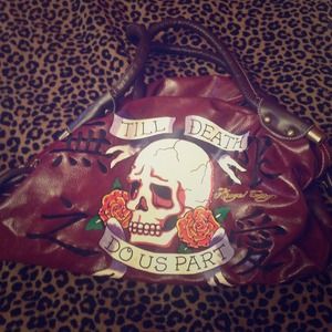 Medium sized maroon bag with quote.