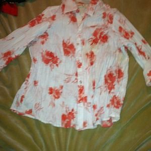 White shirt with Corel flowers on it