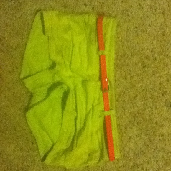 Neon yellow shorts with neon pink belt