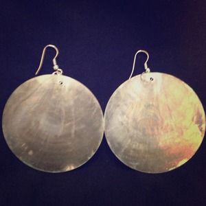 Very light green mother of pearl hued earrings.