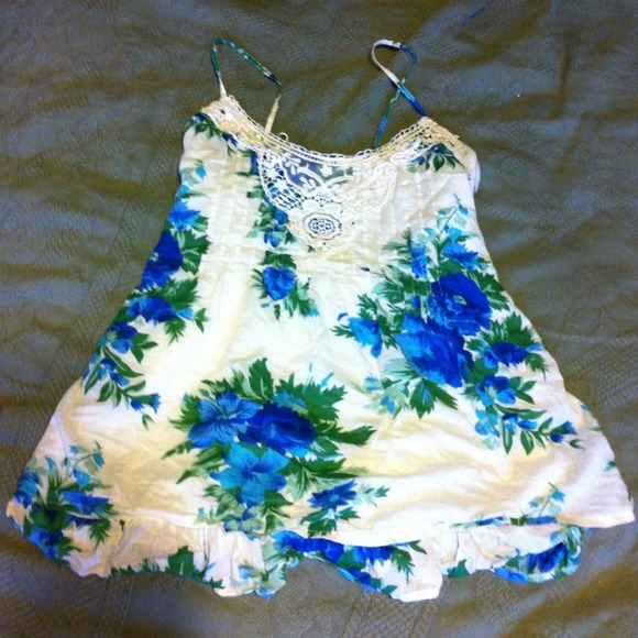 Cute summery floral tank with adjustable straps.
