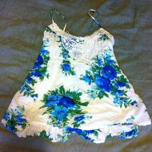 Cute summery floral tank with adjustable straps.