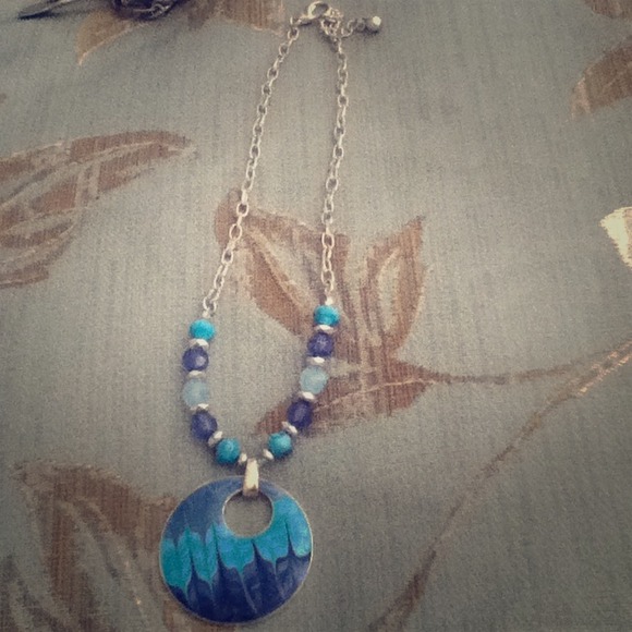 Blue beaded necklace and charm.
