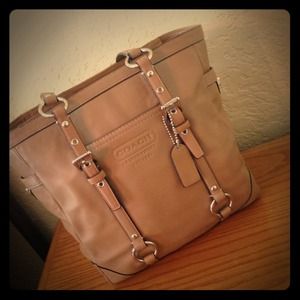 Beige coach purse.