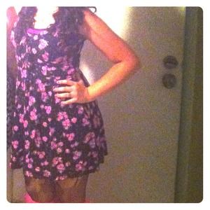 Black dress, pink flowers. Mid thigh length,