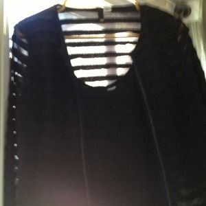 Cute little black sleeveless with little jacket .