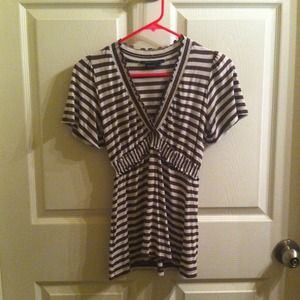Brown and white stripe BCBG flutter sleeve top.