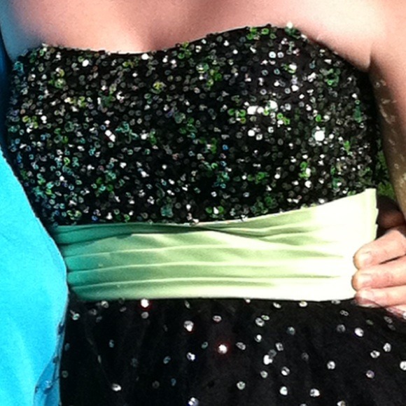 Black dress with green belt