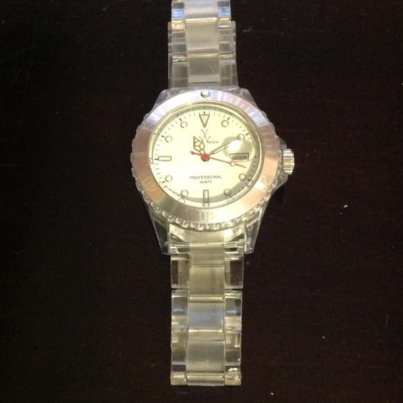 Clear with pink rimmed face Toy watch.