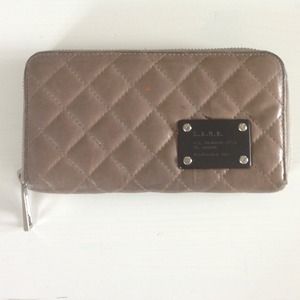 L.A.M.B. gray quilted zipper wallet.
