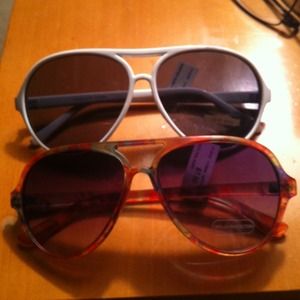 Bundle new aviators, lotion and blush brush.