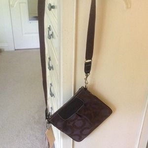 brown cross body Coach purse