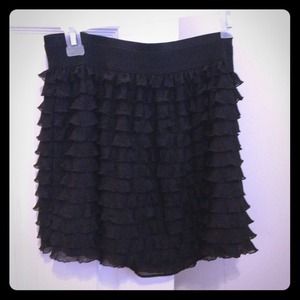 Black ruffle mini skirt