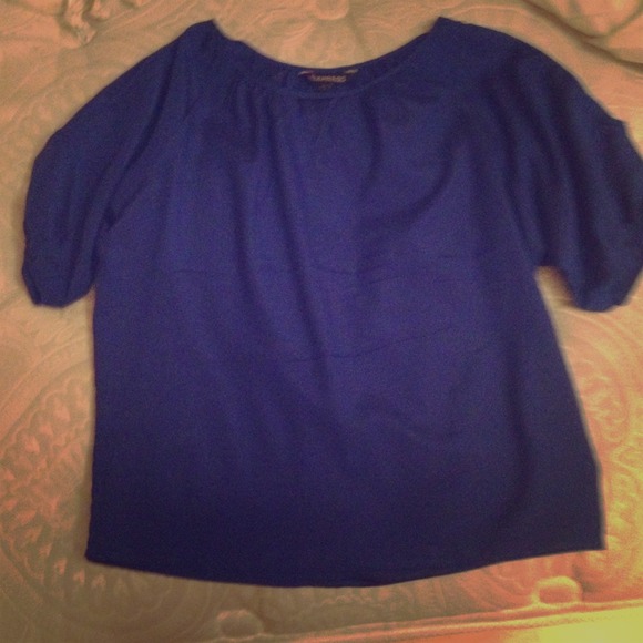 Open shouldered blue shirt