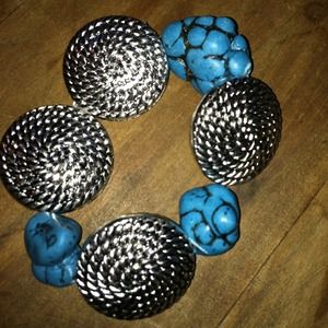 Turquoise stone and silver pendant bracket.