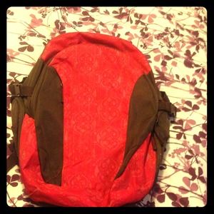 Pink and brow backpack. With laptop holder in it.