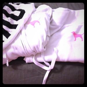 White with black lettering VS Pink track suit