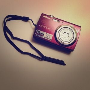 SOLD Nikon purple camera.