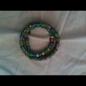 This is a paper bead choker necklace .