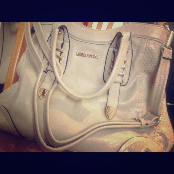 Nude/cream MK handbag.