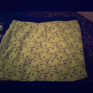 Black bodycon skirt with yellow lace overlay