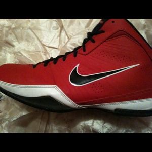 Red white and black Nike basketball sneakers