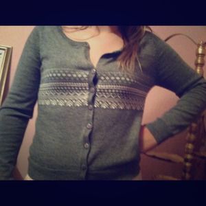 Grey sweater with white print through middle