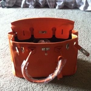 Orange bag with lock and key