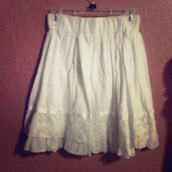 White skirt with embroidered and silk accent