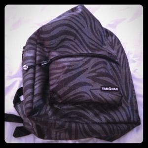 Dark gray backpack with zebra print stripes.
