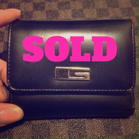 Small gently used Guess wallet.