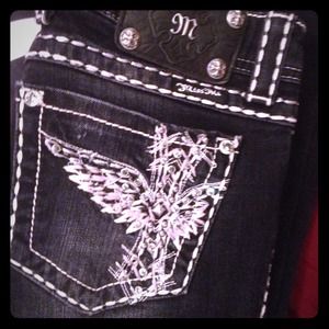 Black/Dark jean w/ white stitching. Miss me jeans
