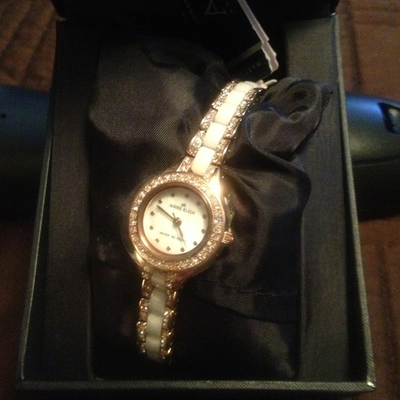 Ladies white, gold and crystal wristwatch