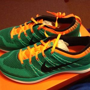 Brand new Nike fly knit lunar orange and teal