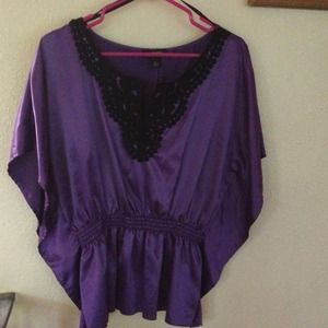 REDUCED. NWOT. Purple and black poncho style top.